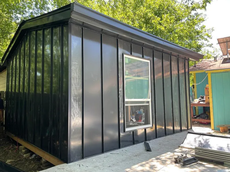 Black standing seam metal wall panels for Roof Inspection in Anacortes